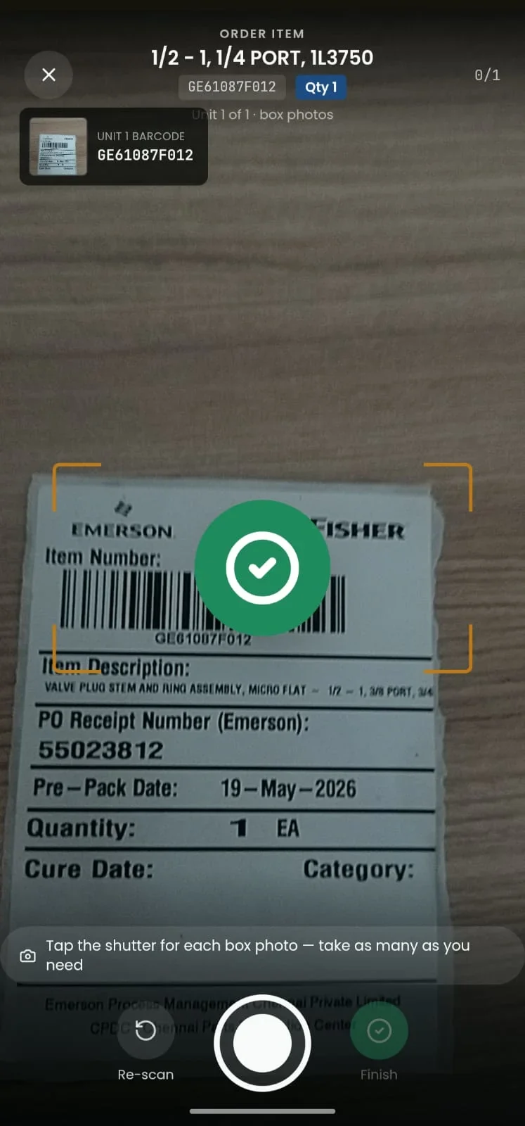 The scan screen confirms the label matches the order with a green tick